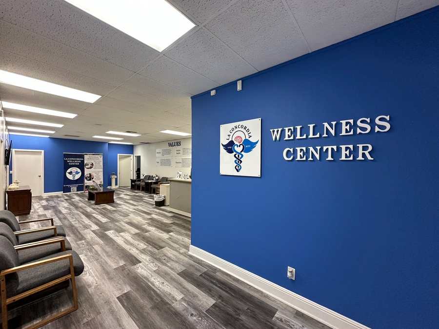 The La Concordia Wellness Center reception area, with the Mind & Body logo on a blue accent wall
